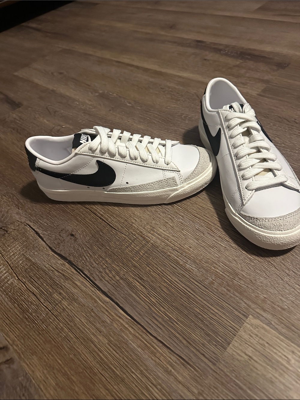 Nike White Low-Top Sneakers with Black Swoosh